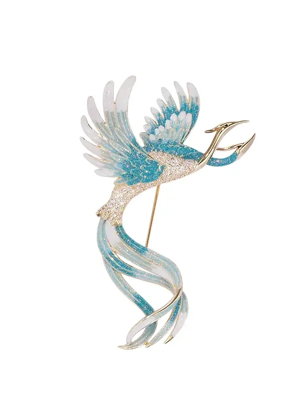 blue enamel bird brooch isolated on white