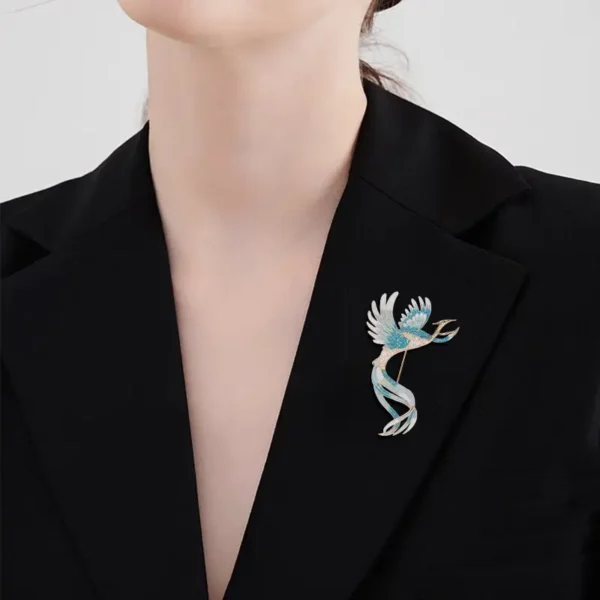 enamel blue bird brooch on black blazer