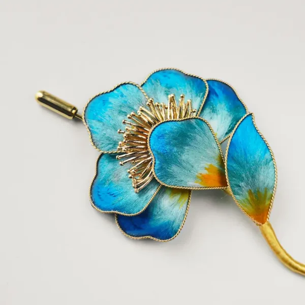 Blue Silk Floral Brooch Detail Close-up of blue silk floral brooch with golden stamen