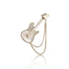 Stylish guitar-shaped brooch with layered chain