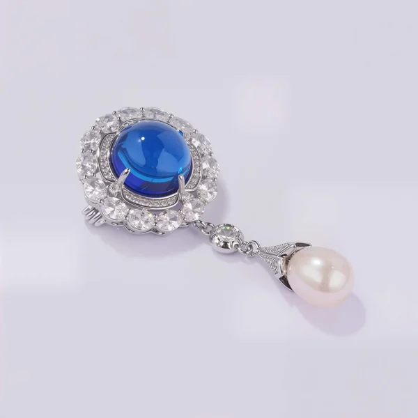 Blue Crystal Pearl Brooch Side Angle Angled view of blue crystal brooch with pearl drop