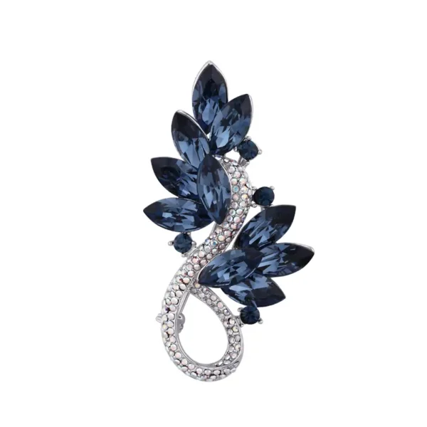 Midnight blue crystal leaf brooch on white background