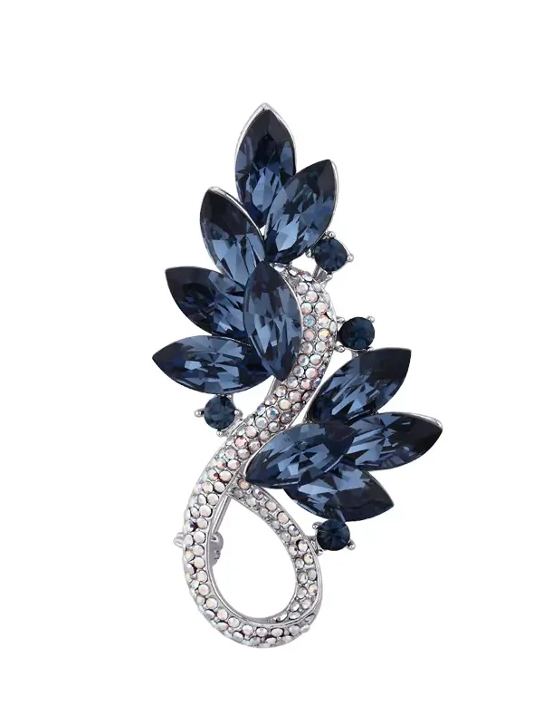 Midnight blue crystal leaf brooch on white background
